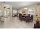 Formal dining room featuring a round table, six chairs, and a large window at 1659 Cherry Blossom Ter, Lake Mary, FL 32746