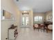 Bright foyer with tile flooring and decorative mirror offers a warm welcome at 1659 Cherry Blossom Ter, Lake Mary, FL 32746