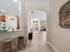 Inviting hallway with tiled floors leading to living spaces and featuring seating at 1659 Cherry Blossom Ter, Lake Mary, FL 32746