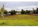 Backyard with lake view at 17394 Million Lakes Ct, Clermont, FL 34714