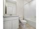 Bathroom featuring modern sink and vanity with shower and bathtub at 17394 Million Lakes Ct, Clermont, FL 34714