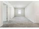 Large bedroom offering neutral tones, cozy carpet, and natural light from a window at 17394 Million Lakes Ct, Clermont, FL 34714