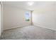 Bright bedroom with neutral walls and plush carpet; great natural light from the window at 17394 Million Lakes Ct, Clermont, FL 34714