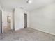 Spacious bedroom featuring carpet, closet, and neutral colors for a cozy and inviting atmosphere at 17394 Million Lakes Ct, Clermont, FL 34714