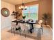 Elegant dining room featuring stylish furnishings, modern decor, and ample natural light at 17394 Million Lakes Ct, Clermont, FL 34714