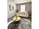 Comfortable seating area bathed in natural light and a stylish rug, creating an inviting atmosphere at 17394 Million Lakes Ct, Clermont, FL 34714