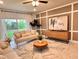 Inviting living room featuring a stylish rug, modern furniture, and an abundance of natural light at 17394 Million Lakes Ct, Clermont, FL 34714