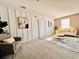 Cozy living area featuring a comfortable chair, love seat, and stylish accents for a relaxing ambiance at 17394 Million Lakes Ct, Clermont, FL 34714