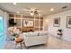 Bright living room with contemporary decor, stylish furniture, and a neutral color palette at 17394 Million Lakes Ct, Clermont, FL 34714