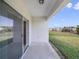 Covered patio offers a perfect space for outdoor seating and enjoying the backyard view at 17394 Million Lakes Ct, Clermont, FL 34714