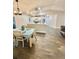 Cozy dining area with views of the kitchen and living room, perfect for Gathering gatherings at 17411 Hillside Dr, Montverde, FL 34756