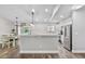 Open concept kitchen featuring stainless appliances and lots of counter space at 17411 Hillside Dr, Montverde, FL 34756