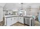Open concept kitchen area, which features updated appliances and a breakfast bar at 17411 Hillside Dr, Montverde, FL 34756