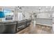 Bright living room with wood-look tile floors and a modern fireplace at 17411 Hillside Dr, Montverde, FL 34756
