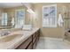 Well-lit bathroom offering double sinks, ample counter space, and natural light at 1814 Old Stable Pt, Chuluota, FL 32766