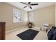 Well lit bedroom with a ceiling fan, two windows with plantation shutters, and beige carpet at 1814 Old Stable Pt, Chuluota, FL 32766