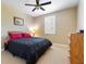 Cozy bedroom features a ceiling fan, a window with plantation shutters, and neutral wall color at 1814 Old Stable Pt, Chuluota, FL 32766