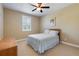 Comfortable bedroom featuring neutral walls, a ceiling fan and a window at 1814 Old Stable Pt, Chuluota, FL 32766