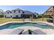 Enjoy a dip in this refreshing pool with a spa, tanning ledge, and covered patio in backyard at 1814 Old Stable Pt, Chuluota, FL 32766