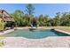 Beautiful pool with a spa and manicured lawn, surrounded by lush trees at 1814 Old Stable Pt, Chuluota, FL 32766