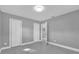 Empty bedroom with two closets and an open doorway at 2012 Dorris Dr, Orlando, FL 32807