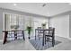 Stylish dining area with a modern table set and sliding glass doors at 2012 Dorris Dr, Orlando, FL 32807