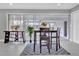 Contemporary dining room with a dark wood table and a bright, airy feel at 2012 Dorris Dr, Orlando, FL 32807