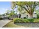 Charming single-story home featuring well-maintained landscaping and a convenient carport at 2012 Dorris Dr, Orlando, FL 32807