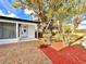 Inviting front of home with brick paver walkway, mature trees, and manicured landscaping at 2012 Dorris Dr, Orlando, FL 32807