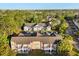 Wide aerial view showing the community's layout amidst lush greenery and neighborhood at 2030 Royal Bay Blvd # 62, Kissimmee, FL 34746