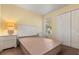 Bright bedroom with large closet and white wood paneled headboard at 2030 Royal Bay Blvd # 62, Kissimmee, FL 34746