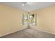 Empty bedroom with carpet and light yellow walls at 2030 Royal Bay Blvd # 62, Kissimmee, FL 34746