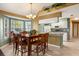 Open dining area adjacent to the kitchen, with hardwood table set for Gathering meals at 2030 Royal Bay Blvd # 62, Kissimmee, FL 34746