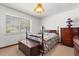 Traditional style bedroom features a four-poster bed, blinds, and carpeted floors at 209 Camden Rd, Altamonte Springs, FL 32714