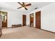 Serene bedroom featuring ceiling fan, carpeted floor, and multiple closets and doors at 209 Camden Rd, Altamonte Springs, FL 32714