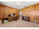 Wood-paneled bedroom with carpet, desk, and storage at 209 Camden Rd, Altamonte Springs, FL 32714