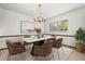 Bright dining room showcasing modern chandelier, sleek marble table, and contemporary furnishings at 209 Camden Rd, Altamonte Springs, FL 32714