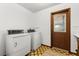 Laundry room features white appliances, a bright room and an exterior door at 209 Camden Rd, Altamonte Springs, FL 32714