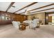 Inviting living room featuring wood beams, a stone fireplace, and comfortable seating arrangements at 209 Camden Rd, Altamonte Springs, FL 32714