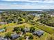 Aerial view shows the beautiful home site on large lot with a pond nearby at 2106 Ridgewind Way, Windermere, FL 34786