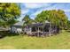 Screened in back patio features an in-ground pool, chairs, and multiple entry doors at 2106 Ridgewind Way, Windermere, FL 34786