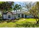 Beautiful exterior view of a single-story home with stone accents and a manicured lawn at 2106 Ridgewind Way, Windermere, FL 34786