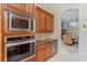 A kitchen featuring granite countertops, stainless steel appliances, and a wine cooler at 2106 Ridgewind Way, Windermere, FL 34786