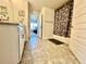 Bathroom features a tile floor, white vanity with granite countertop, and a shower-tub combo at 2107 Cartgate Ln, Winter Haven, FL 33884