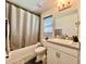 Bathroom featuring a tub, shower, granite countertop vanity, and modern fixtures at 2107 Cartgate Ln, Winter Haven, FL 33884