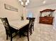 Well-lit dining area featuring stylish decor, tile flooring, and a view of the 'Cantina' at 2107 Cartgate Ln, Winter Haven, FL 33884