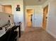 Hallway with carpet floors and white trim doors leads into other rooms of the house at 2107 Cartgate Ln, Winter Haven, FL 33884