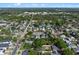 Wide aerial view displaying the property within a leafy residential neighborhood at 2108 Delaney Ave, Orlando, FL 32806