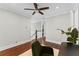 Bedroom featuring hardwood floors and a view of the staircase at 2108 Delaney Ave, Orlando, FL 32806