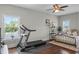 Spacious bedroom featuring a large window, ceiling fan, a treadmill and nice furniture at 2108 Delaney Ave, Orlando, FL 32806